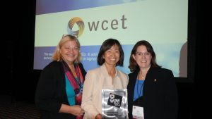Dr. Ellen Wagner, Dr. Hae Okimoto, Dr. Kara Monroe pose with WOW Award